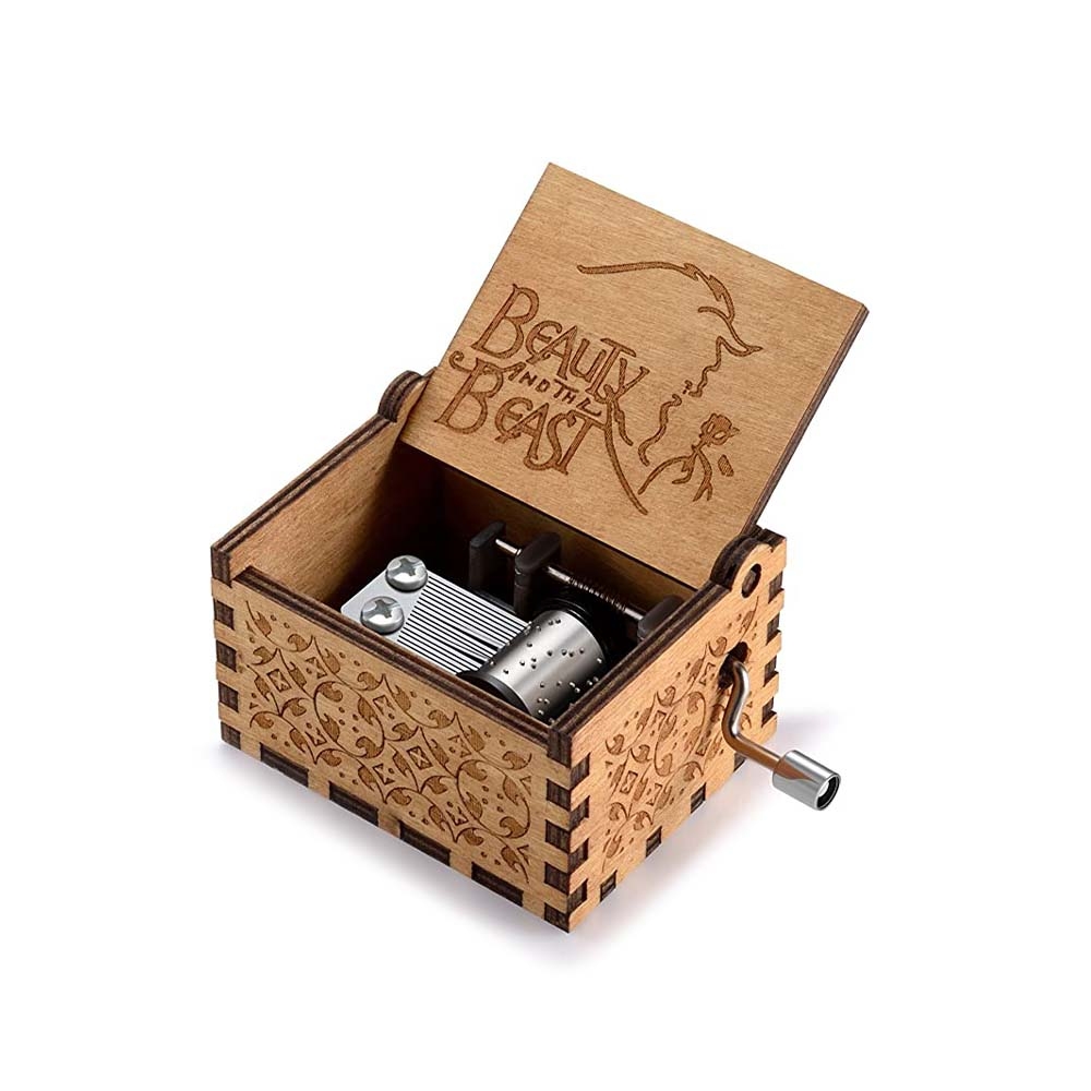 Carved wooden hand crank music box