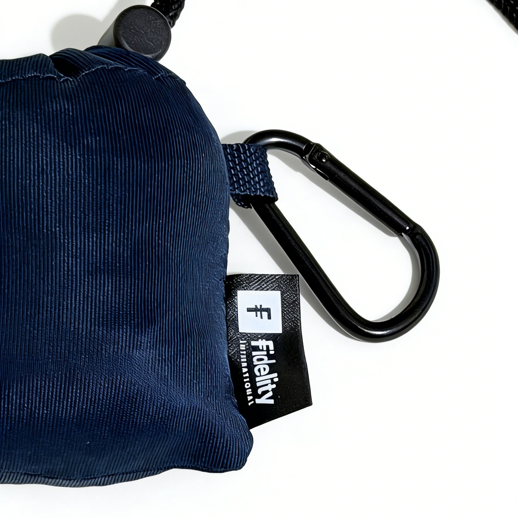 Foldable shopping bag with a drawstring pouch and a carabiner