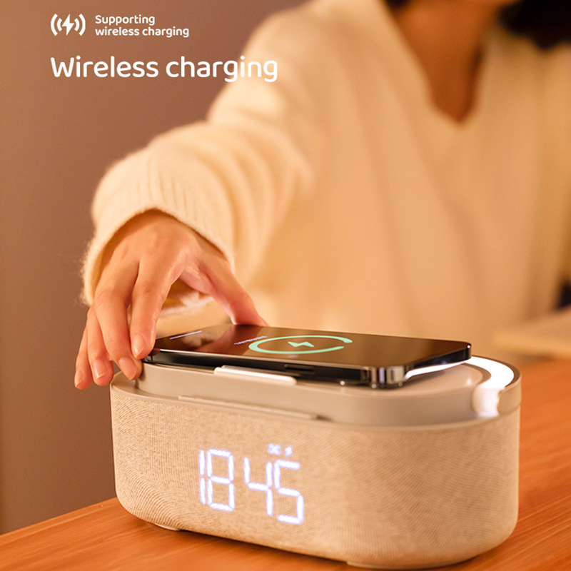Wireless charging with speaker night light clock phone holder